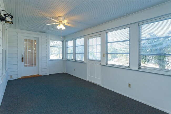 Building Photo - Run don't walk for this one of a kind beautifully maintained Old Florida Charmer on a park like d...