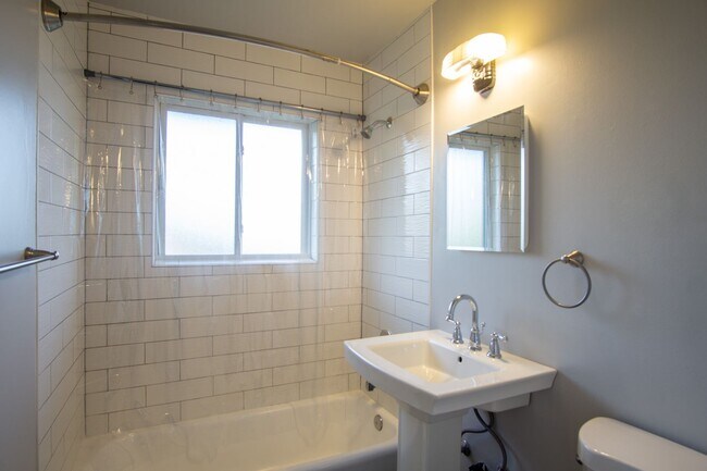 Building Photo - ONE MONTH FREE! Renovated Mid-Century 2Bdr w/Hardwoods, Dishwasher + Pets OK