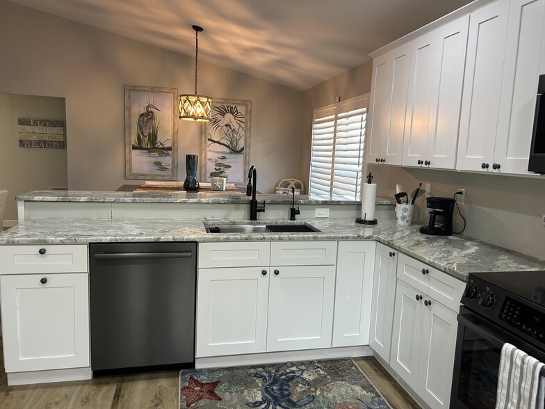 Kitchen facing dining area - 27594 Shore Dr