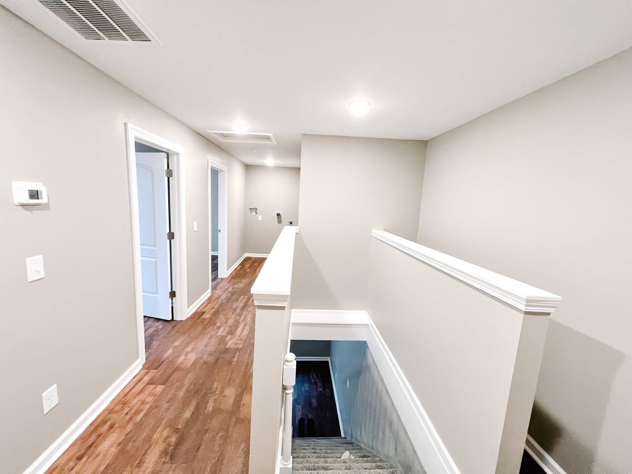 Upstairs hallway with laundry hookups - 801 Poplar Ave