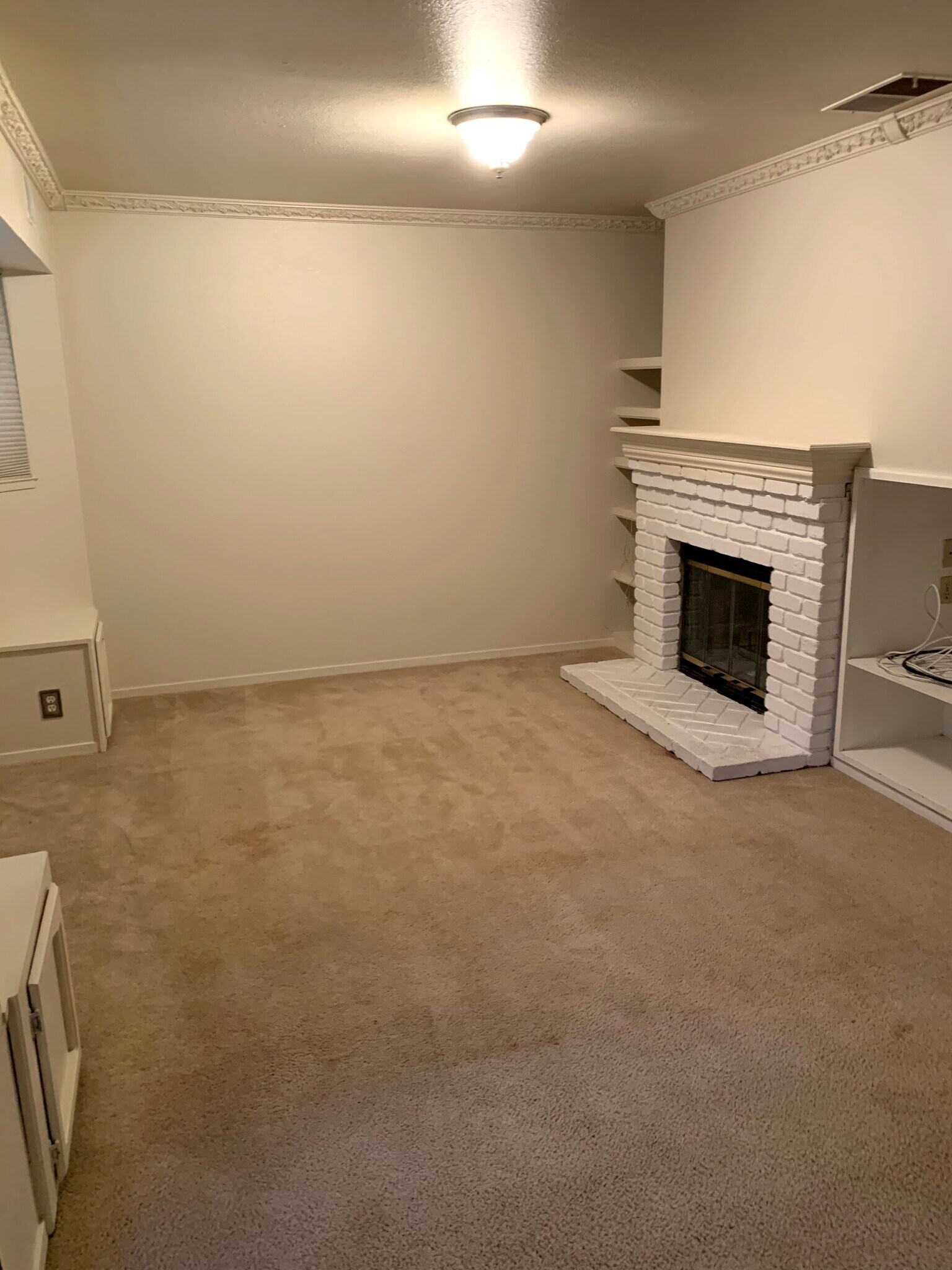 primary bedroom with fireplace & built-in bookshelves - 111 Sequoia Ave