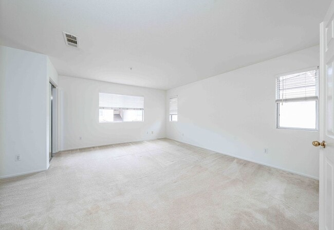 Building Photo - Gated Townhome with Updated Kitchen and Private Backyard