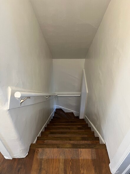 Stairs leading to the second floor from the kitchen. - 126 Merion Ave