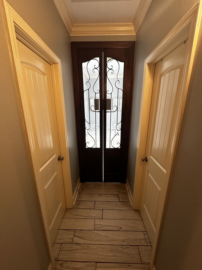 Entry to Master bath with 2 walk in closets - 513 Cliff Bullock Dr