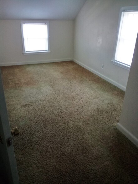 Small Bedroom Half Way Up Stair Way - 207 Sunflower Ave