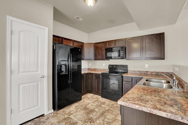 Building Photo - Modern Townhome with Central A/C, 2-Car Ga...