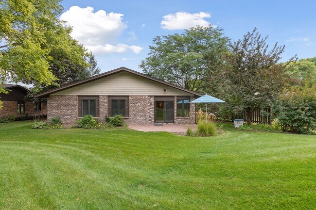 Patio area off the sun room and great outdoor space in the backyard - 145 Holly Ln N