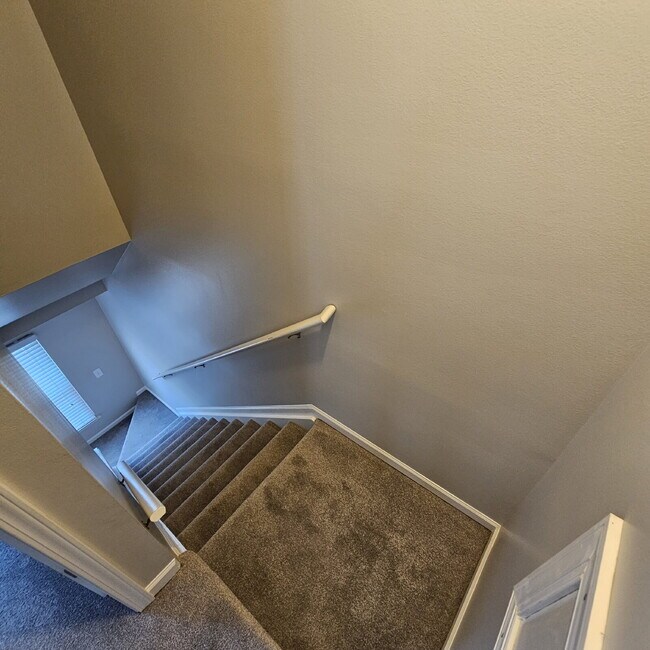 Building Photo - 2 Bedroom, 1.5 Bath Townhouse with Galley Kitchen & All Appliances, Open Living Area, Finished Ba...