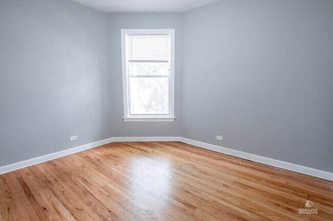 Building Photo - Modern 4BR Apartment with Hardwood Floors, Balcony & Central A/C