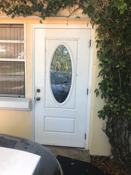 front door private entrance park right next to door - 630 NW 7th Ave