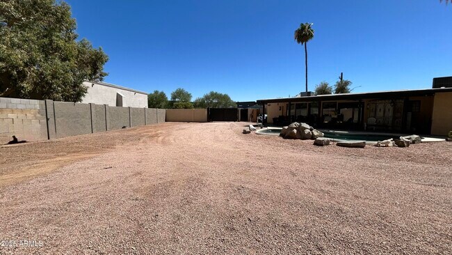 Building Photo - 7220 E Sweetwater Ave