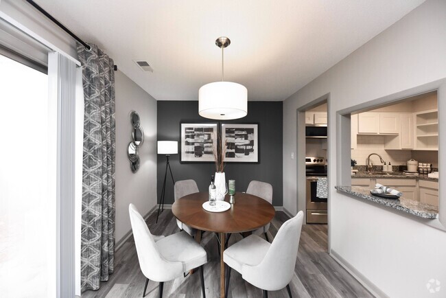 Dining area with hardwood-style flooring - Edison at Meridian Hills