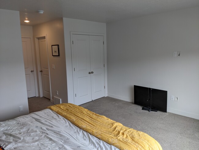 Main bedroom includes his and her closets as well as in-suite bathroom with walk-in shower - 4312 E Grassland Way