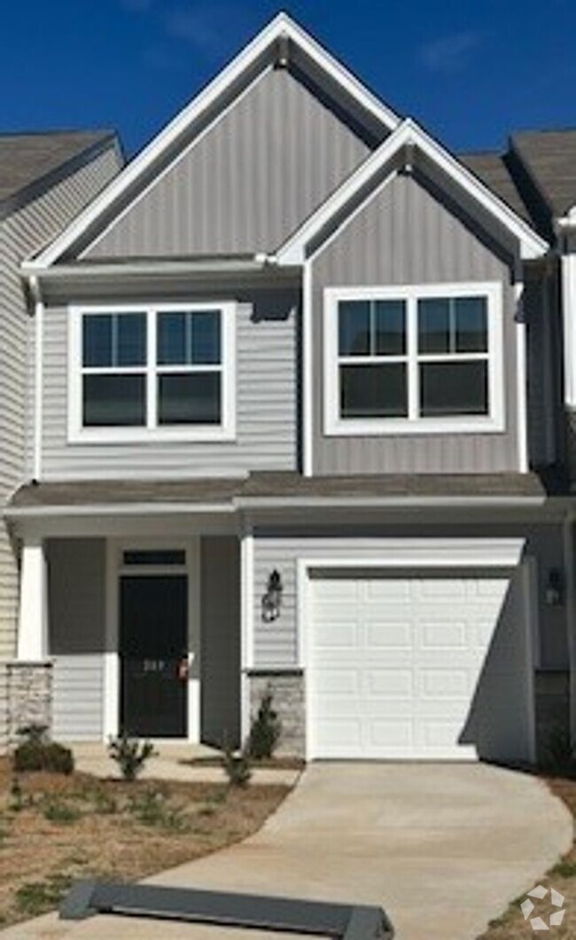 Building Photo - Stunning new 3-bedroom townhouse now avail...