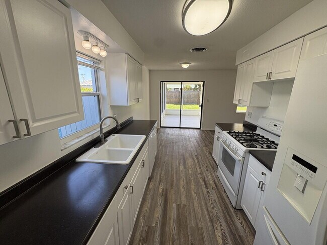 Building Photo - Coastal Living Starts Here – Renovated 4BR Home Just 10 Minutes from the Beach