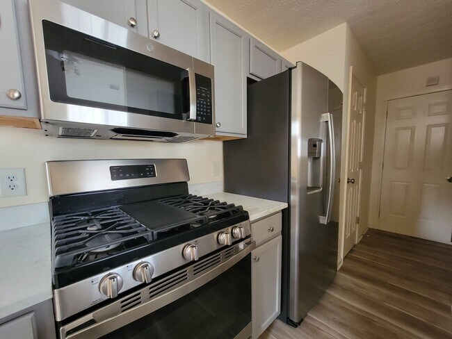 Building Photo - Lake Front Property. Loft - Swim/Tennis - Stainless Steel Appliances