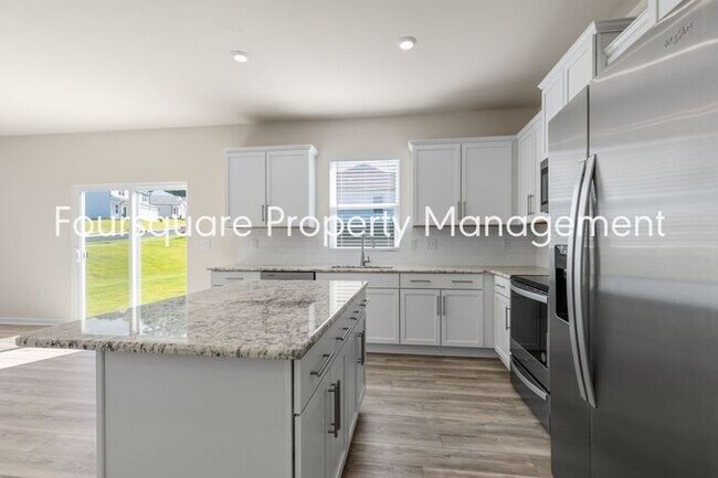 Building Photo - 4 Bedroom Home with 2nd Floor Loft- Kitchen Island & 2-Car Garage – Convenient Raleigh Location