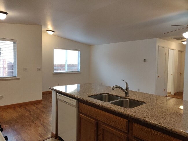 Building Photo - 2x2 duplex with a fenced yard, single-car ...