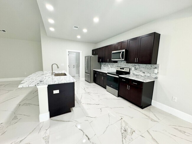 Building Photo - LOOK AT THIS ONE! BEAUTIFUL home with a pond view right outside the back patio!