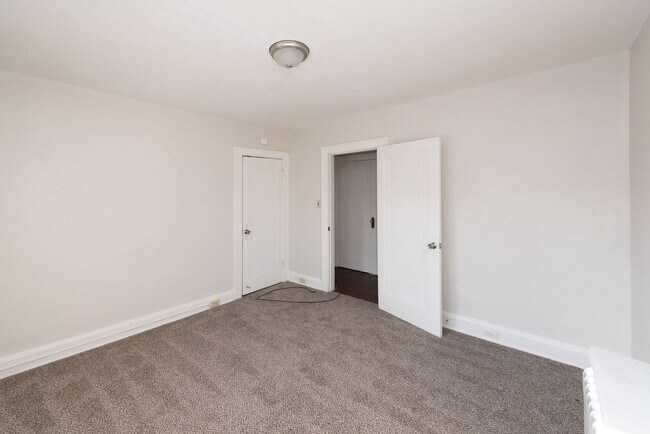 Building Photo - Beautifully updated Tudor style duplex. Up...