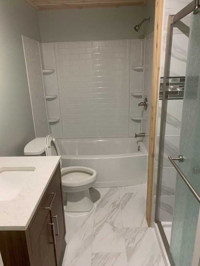 Full bathroom with shower and tub - 1815 E Hazzard St