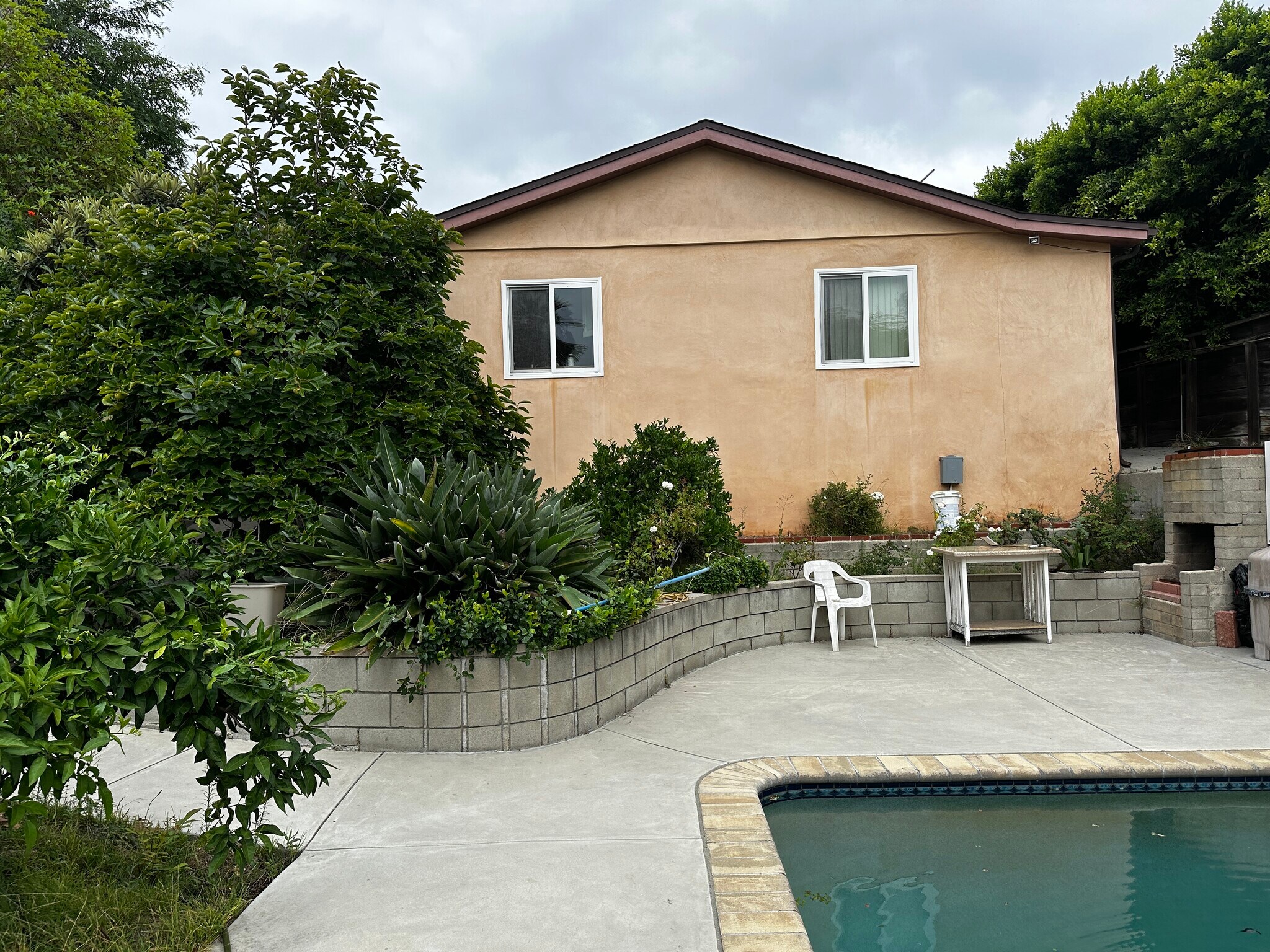 Back wall of the unit & backyard - 1054 E Providencia Ave