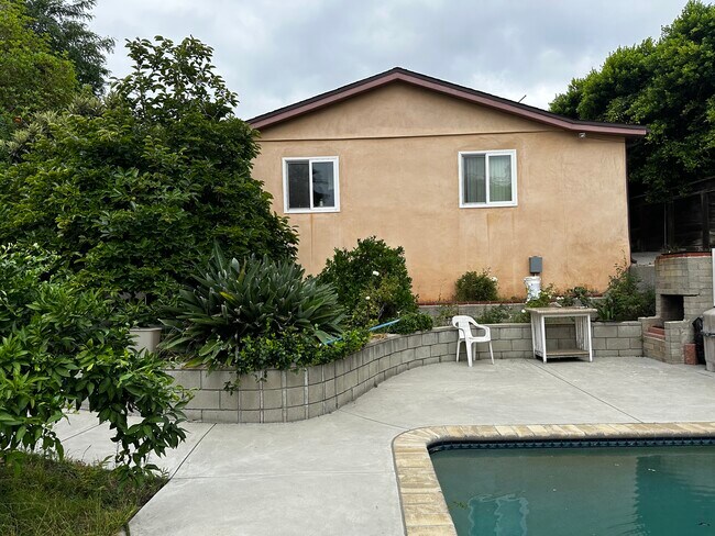 Back wall of the unit & backyard - 1054 E Providencia Ave