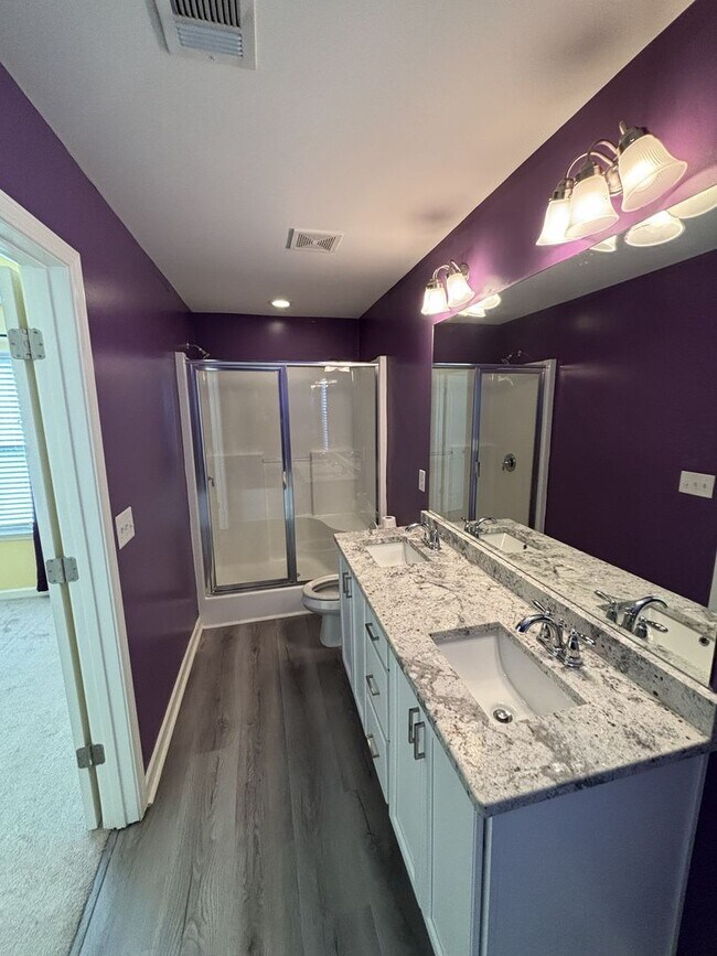 Building Photo - Gated Private Community! Spacious 3 Bedroom and 2.5 Bath End Unit Townhome