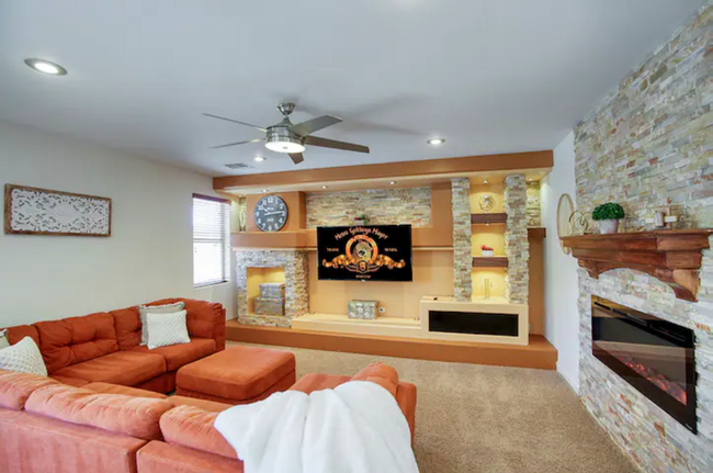 Living Room with Fireplace & TV - 5831 W Plum Rd