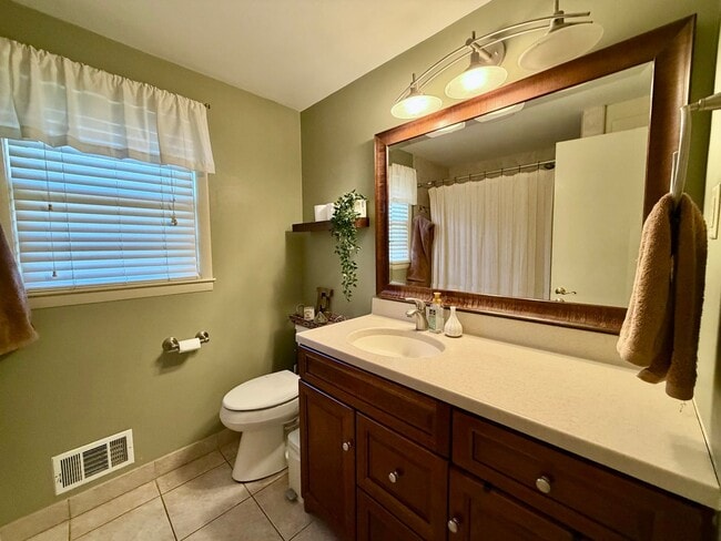 Building Photo - {7710} Prairie Village Split Level with Two Car Garage + Two Full Bathrooms + Hardwood Floors + U...