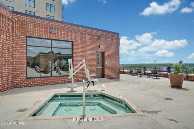 Building Photo - Welcome to your dream condo in the heart o...