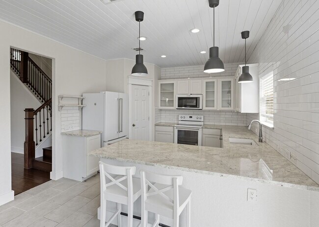 Building Photo - Discover the perfect blend of comfort and space at 6323 Myrtle.