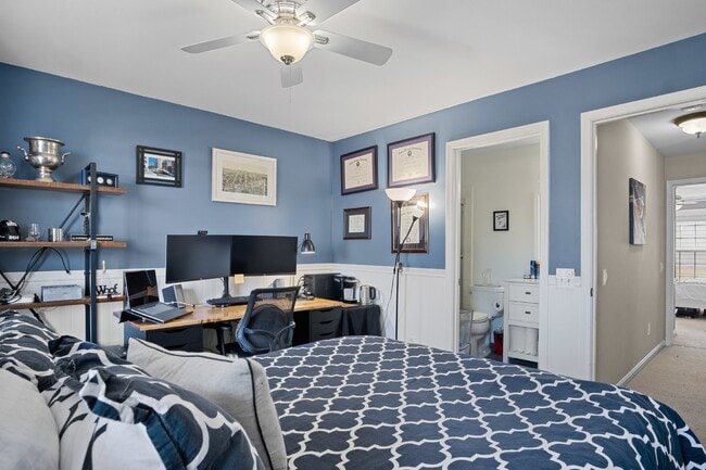 Building Photo - This inviting two-level townhome offers comfort and style, featuring gleaming hardwood floors on ...