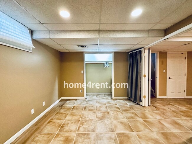 Building Photo - A Lovely, Four Bedroom Lenexa Home w/ Wood...