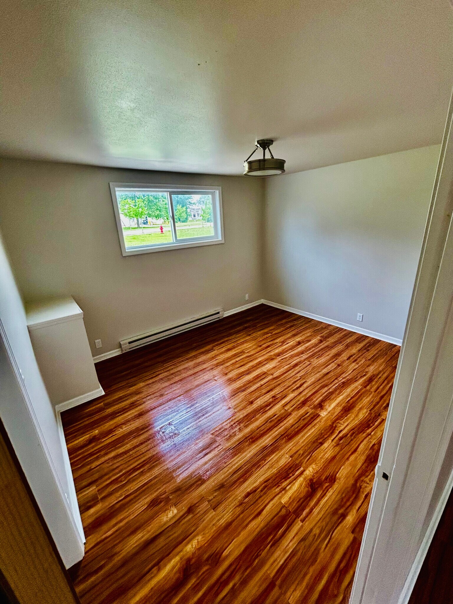 Bedroom 2 with new LVP Flooring - 931 E Clay St