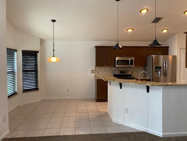 Building Photo - Lakefront 3-Bedroom Pool Home in Gated Com...