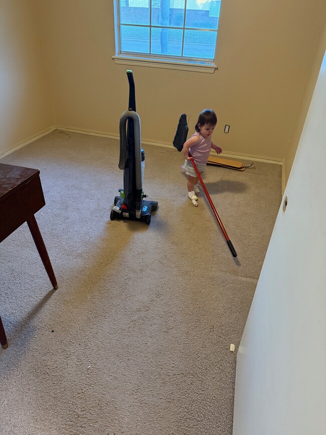 My grandaughter helping clean bedroom 2 - 3009 N Woodcrest Dr