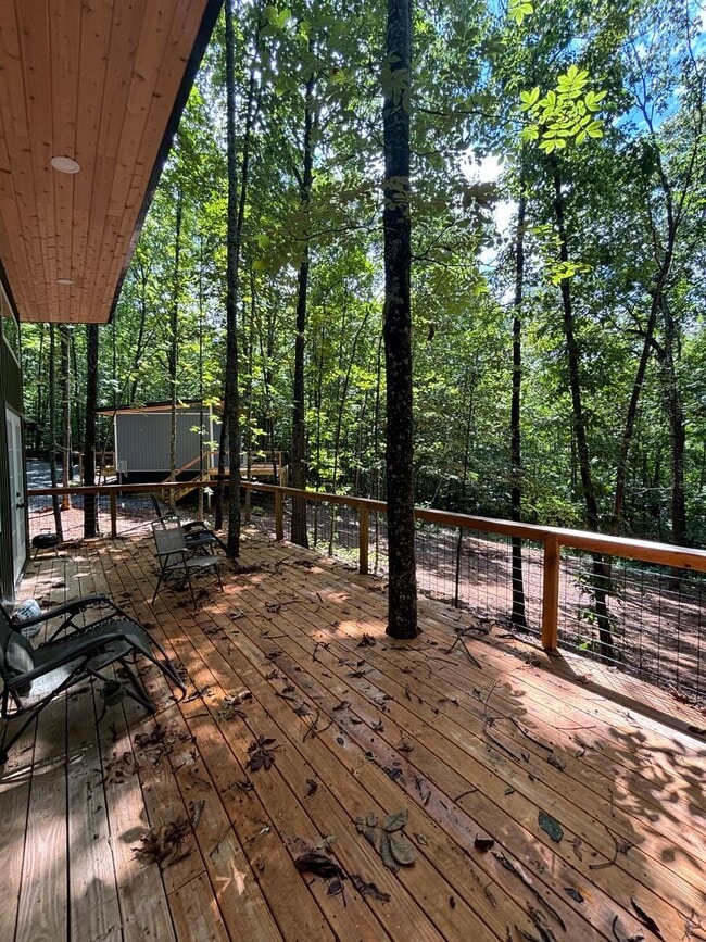Building Photo - Cozy, Modern Tiny Home with Wrap-Around Po...