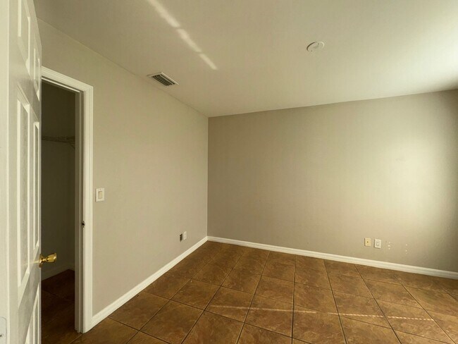 Building Photo - Experience this Cape Coral 3 bedroom 2 bath corner duplex with 1 car garage and screened in lanai.