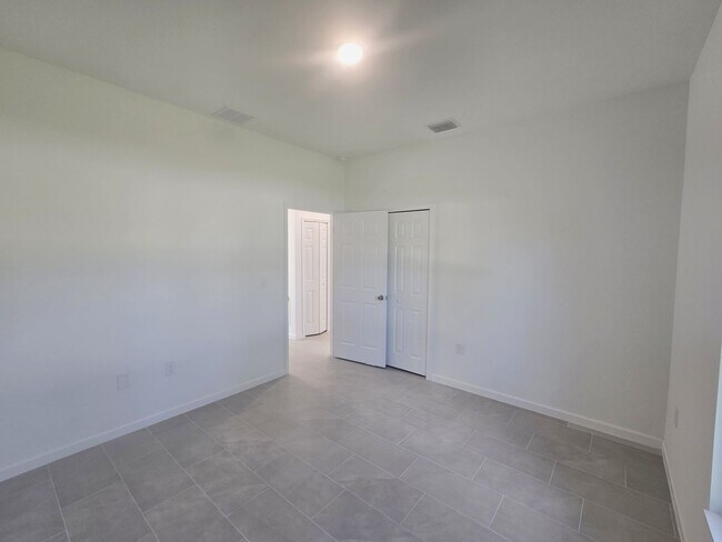 Building Photo - BRAND NEW-- TWO BEDROOM + TWO BATHROOMS- SOUTH LEHIGH ACRES