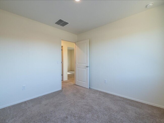 Building Photo - Spacious 4-Bedroom Home with Open Layout & Turf Backyard