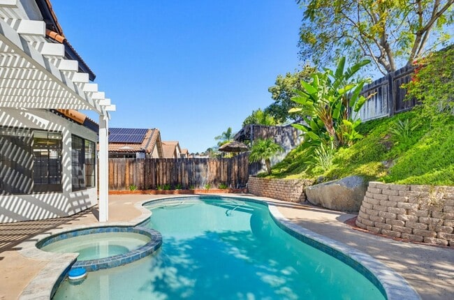 Building Photo - Stunning Upgraded 4BR Home with Pool in Desirable Rancho San Diego – Move-In Ready