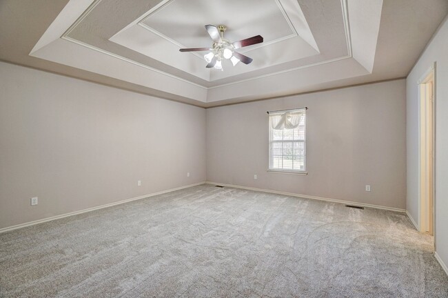 Building Photo - Spacious 4-Bedroom Home with Fireplace, Is...