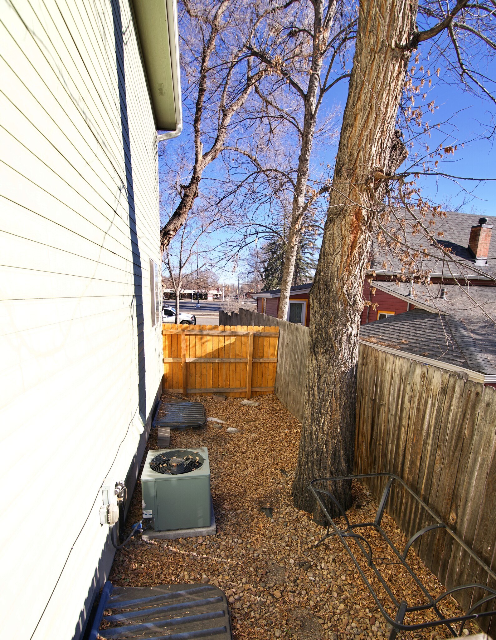 Side of Fenced yard: AC unit - 903 Terry St