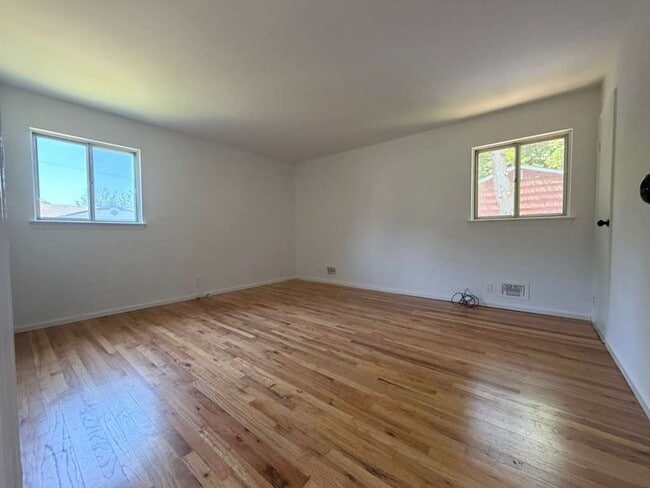 Building Photo - Spacious 4-Bedroom Home with Functional Layout, Backyard Access & Attached Garage