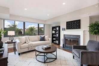 1633 Q living area with fireplace (virtually staged) - 1633 Q Apartments
