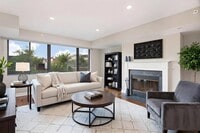 1633 Q living area with fireplace (virtually staged) - 1633 Q Apartments