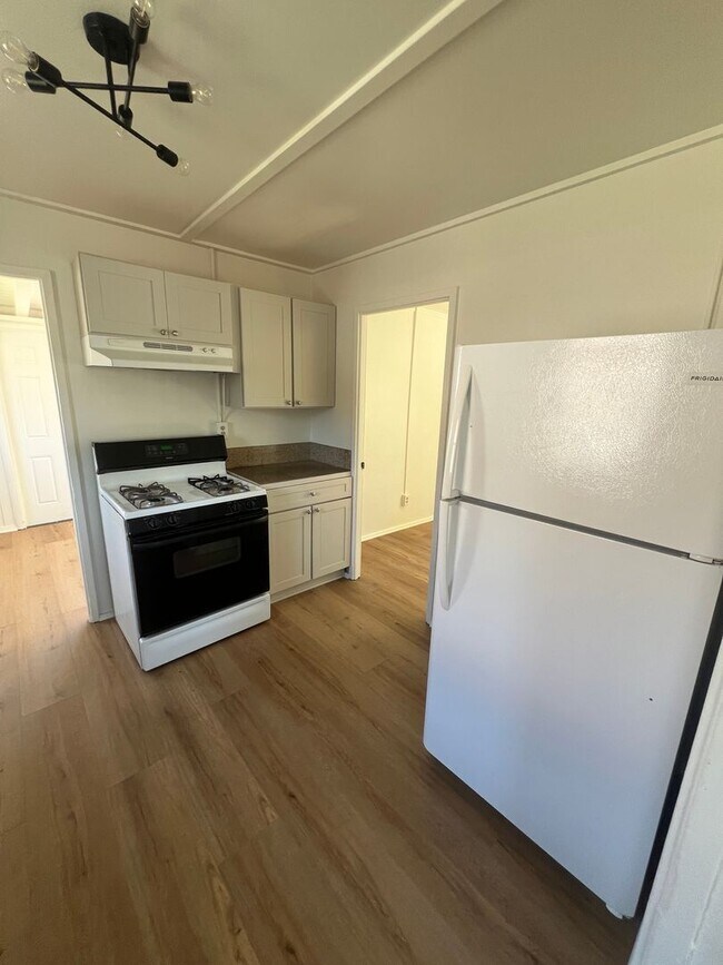 Building Photo - CHARMING! Remodeled 2 Bedroom home with storage and yard
