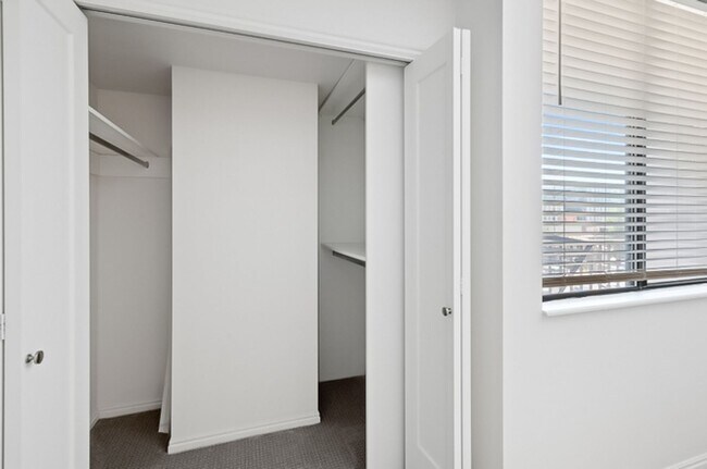 Building Photo - 2BR Condo w/ Covered Parking and Balcony Views at Broadway Towers