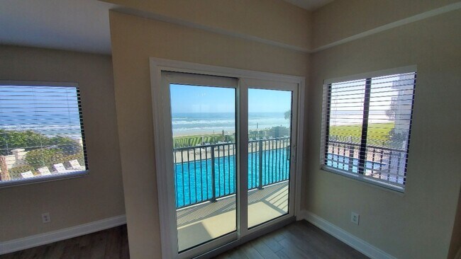 Building Photo - Oceanfront Poolside 2/2 Condo